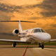 Cessna Citation CJ4 jet parked on the runway during a dramatic sunset