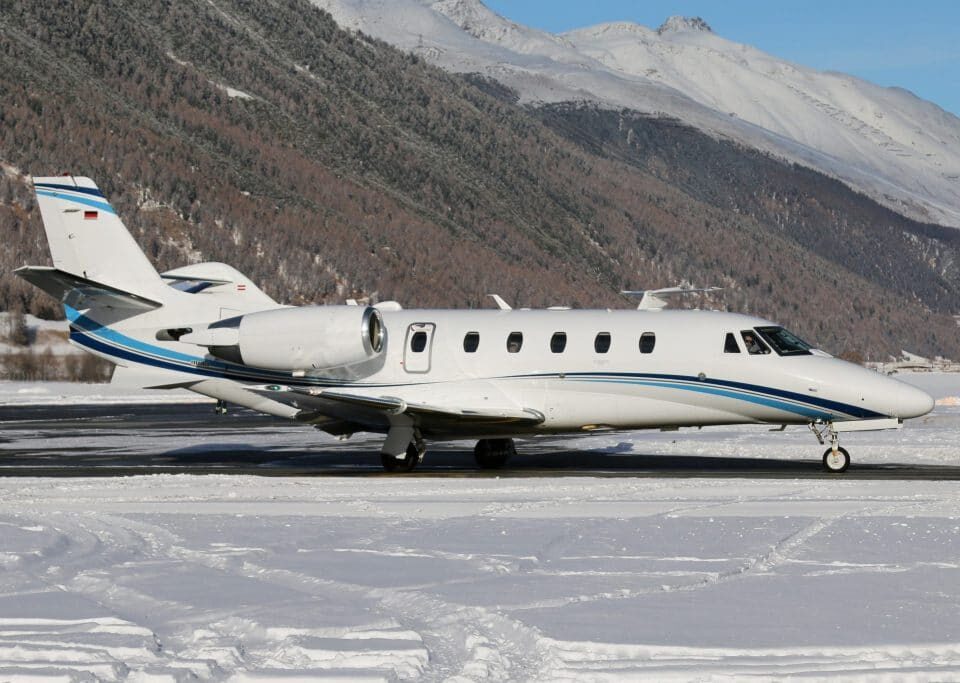 Citation XLS+ business jet on a snowy runway.