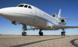 Falcon 900 private jet parked on tarmac