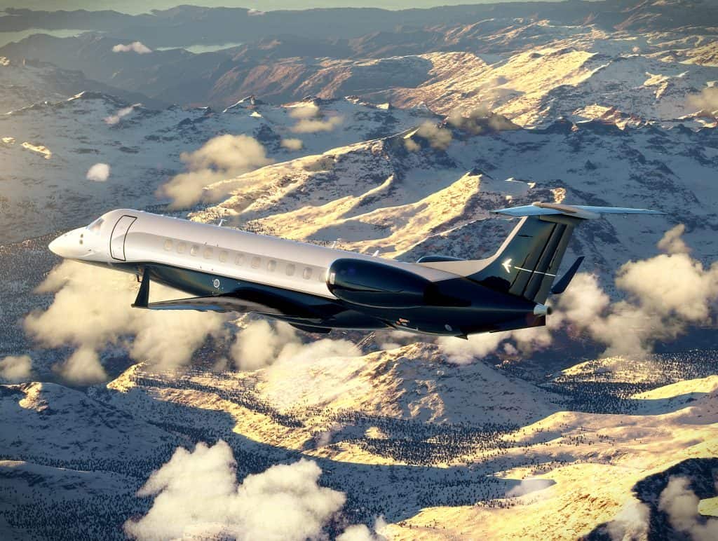 Embraer Legacy 650 flying over mountain terrain