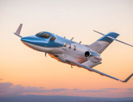 HondaJet Elite flying at sunset with over-the-wing engines