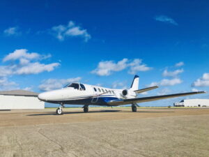 Citation II SP light jet parked on ramp under blue sky