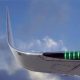 Close-up of an aircraft winglet with navigation light against a cloudy sky