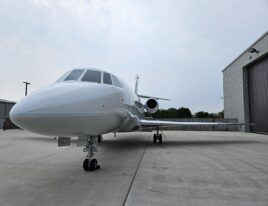 Forward view of Falcon 2000 parked at hangar