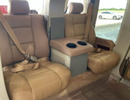 Rear passenger seating inside 1999 Bell 407 helicopter with tan leather interior