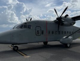 Forward view of C-23B+ turboprop aircraft on ground