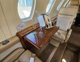 Citation III cabin side view with champagne bucket and glasses on table