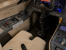 2002 Dassault Falcon 2000 cockpit showing the pilot seat, flight controls, avionics displays, and center console.