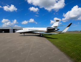 2002 Dassault Falcon 2000 business jet parked on an airport ramp showing its full exterior profile.