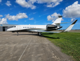 2002 Dassault Falcon 2000 business jet shown in a full side profile while parked on an airport ramp.