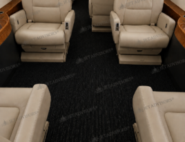 2002 Dassault Falcon 2000 main cabin featuring cream leather executive seating and spacious center aisle.